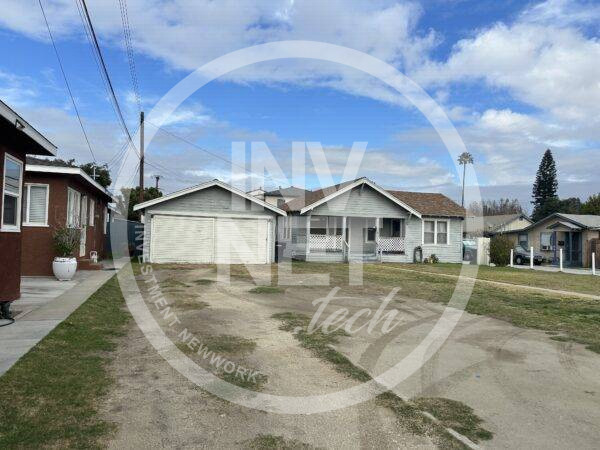 Exterior front... no driveway. Both front doors are off the porch